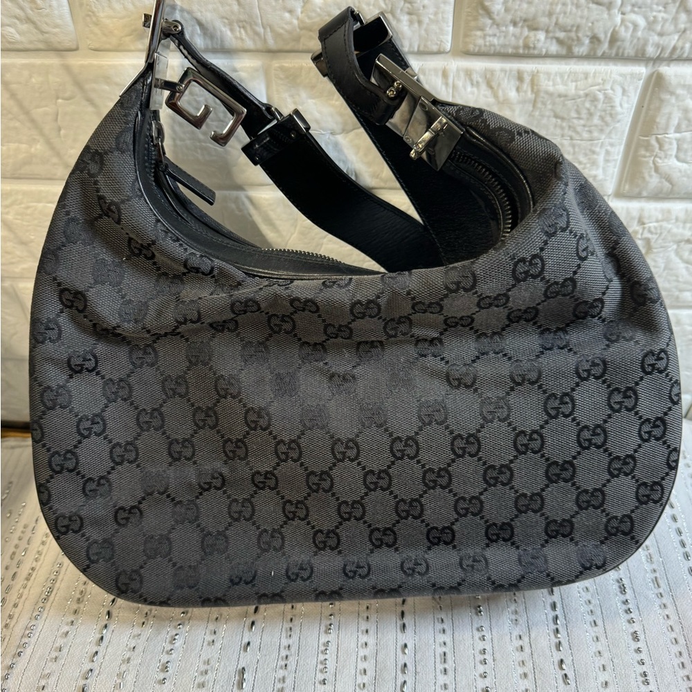 Black Gucci hobo bag.